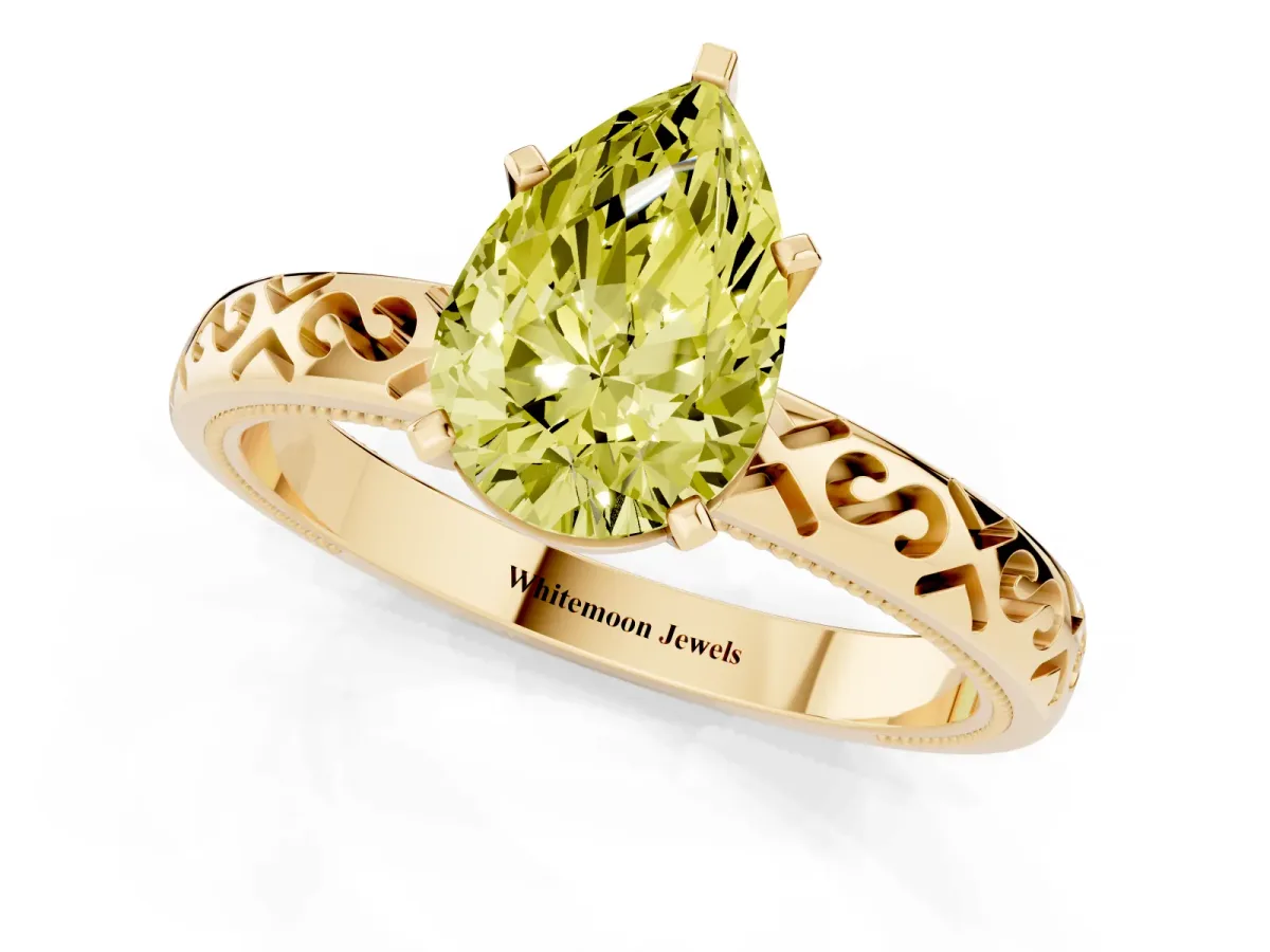 Fancy Yellow Pear Cut Solitaire Engagement Ring with Scrollwork Band and Four-Prong Setting Yellow gold