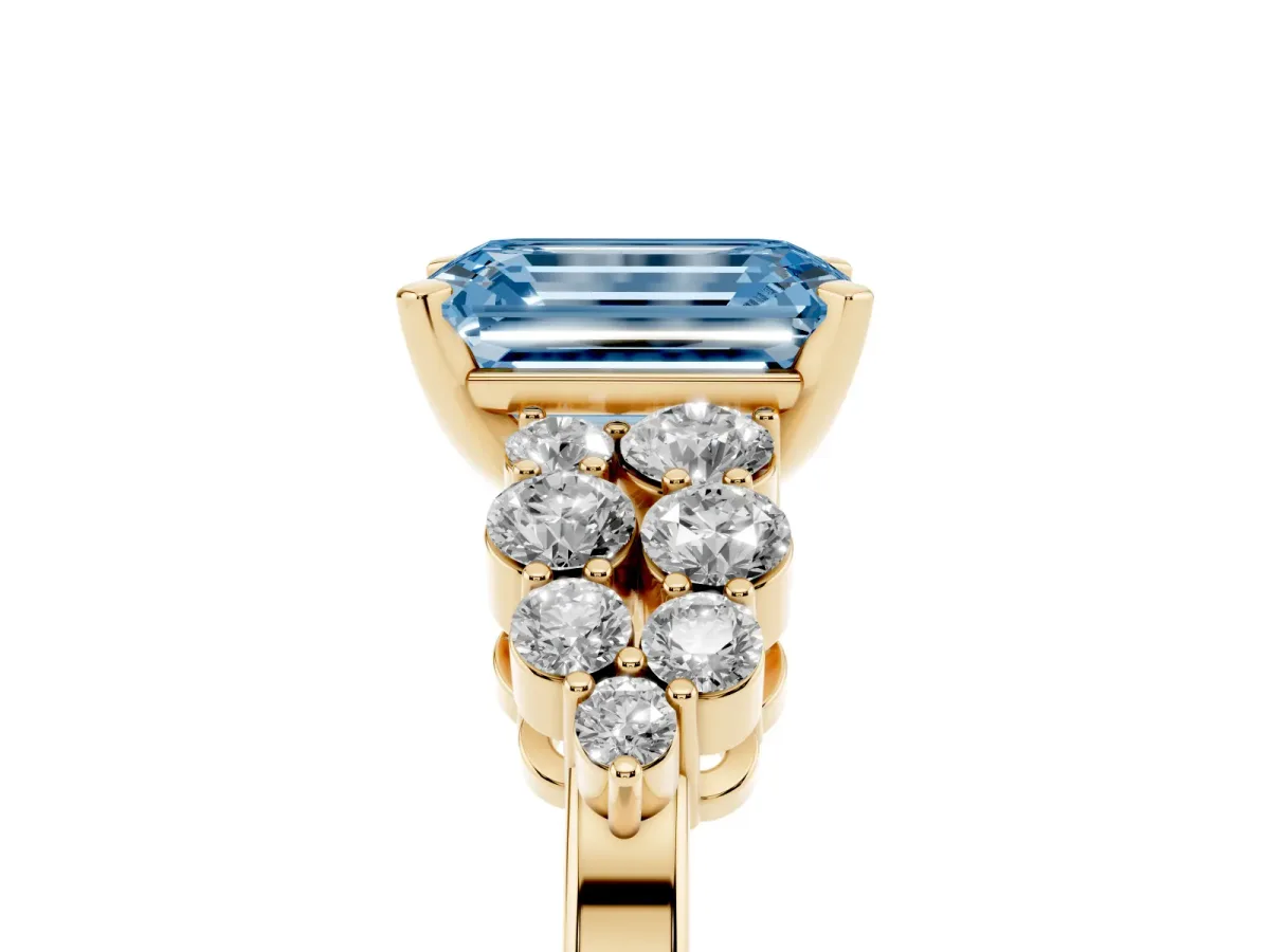Fancy Blue Emerald Cut Cluster Diamond Engagement Ring with Pavé Band and Four-Prong Setting Yellow gold