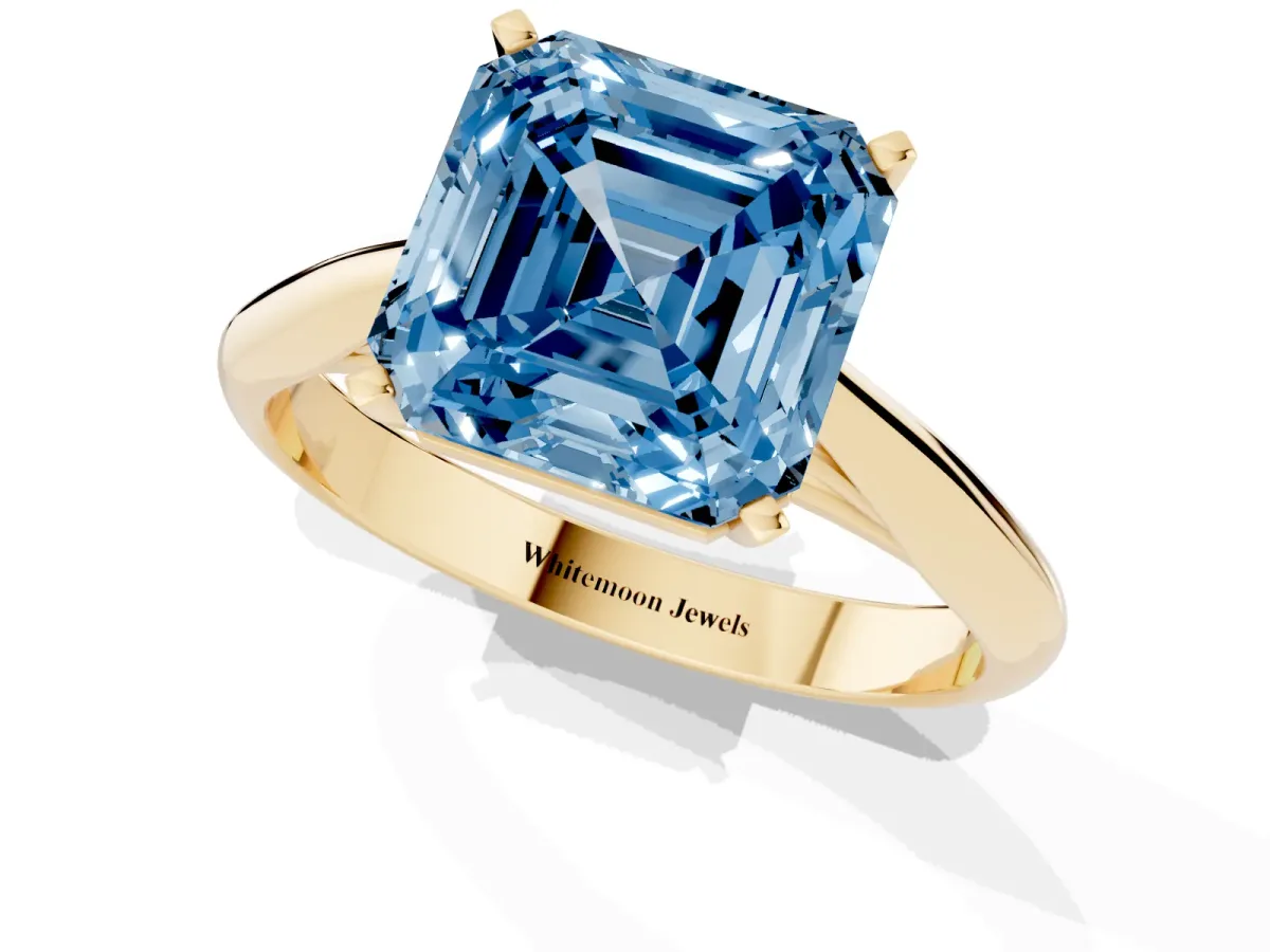 Fancy Blue Asscher Cut Diamond Solitaire Engagement Ring with Cathedral Setting and Four-Prong Mount Yellow gold