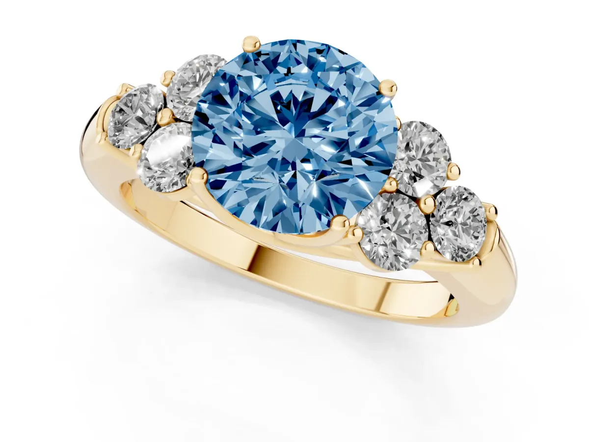 Fancy Blue Round Cut Cut Diamond Cluster Ring with Round Accent Stones and Prong Setting on a Classic Band Yellow gold
