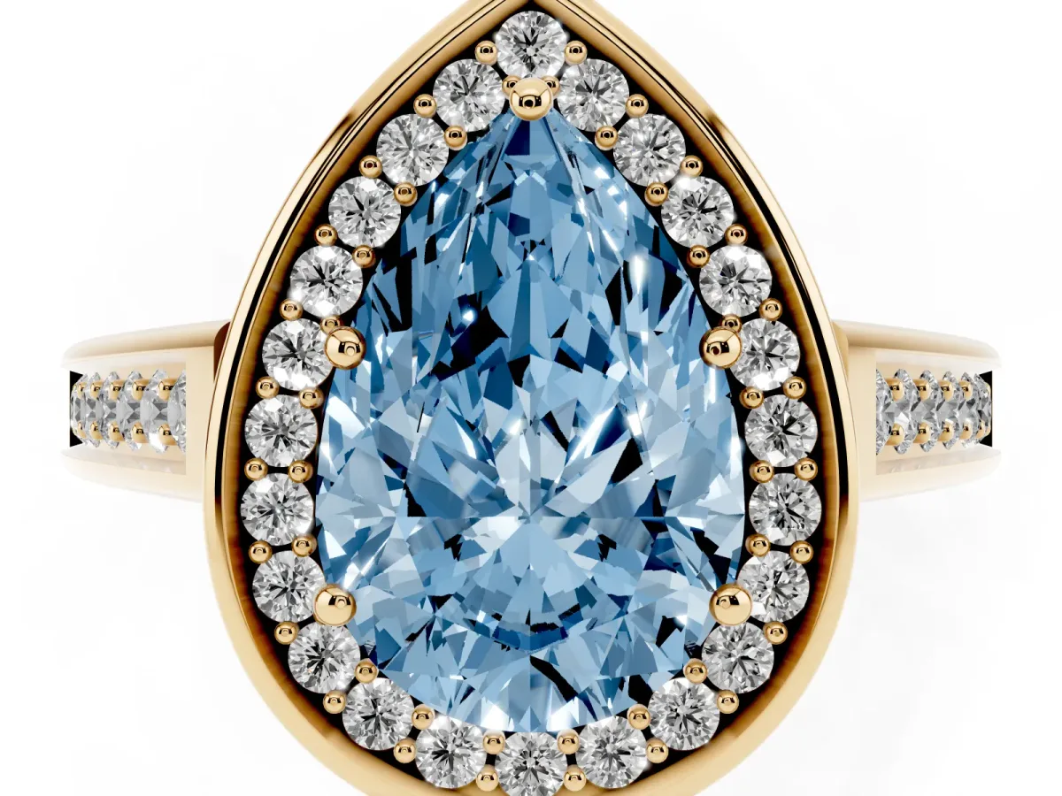 Fancy Blue Pear Cut Halo Solitaire Diamond Ring with Pave Band and Bezel Setting Yellow gold