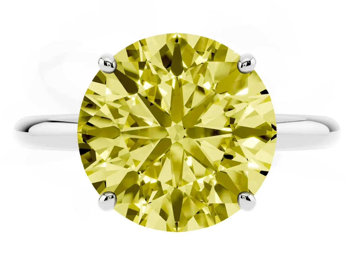 Fancy Yellow Round Cut Solitaire Diamond Ring with Four-Prong Setting on a Plain Band White gold