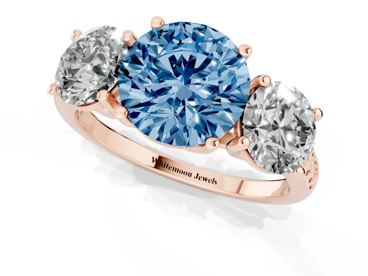Fancy Blue Three-Stone Round Cut Diamond Ring with Round Pavé Band and Prong Setting Rose gold