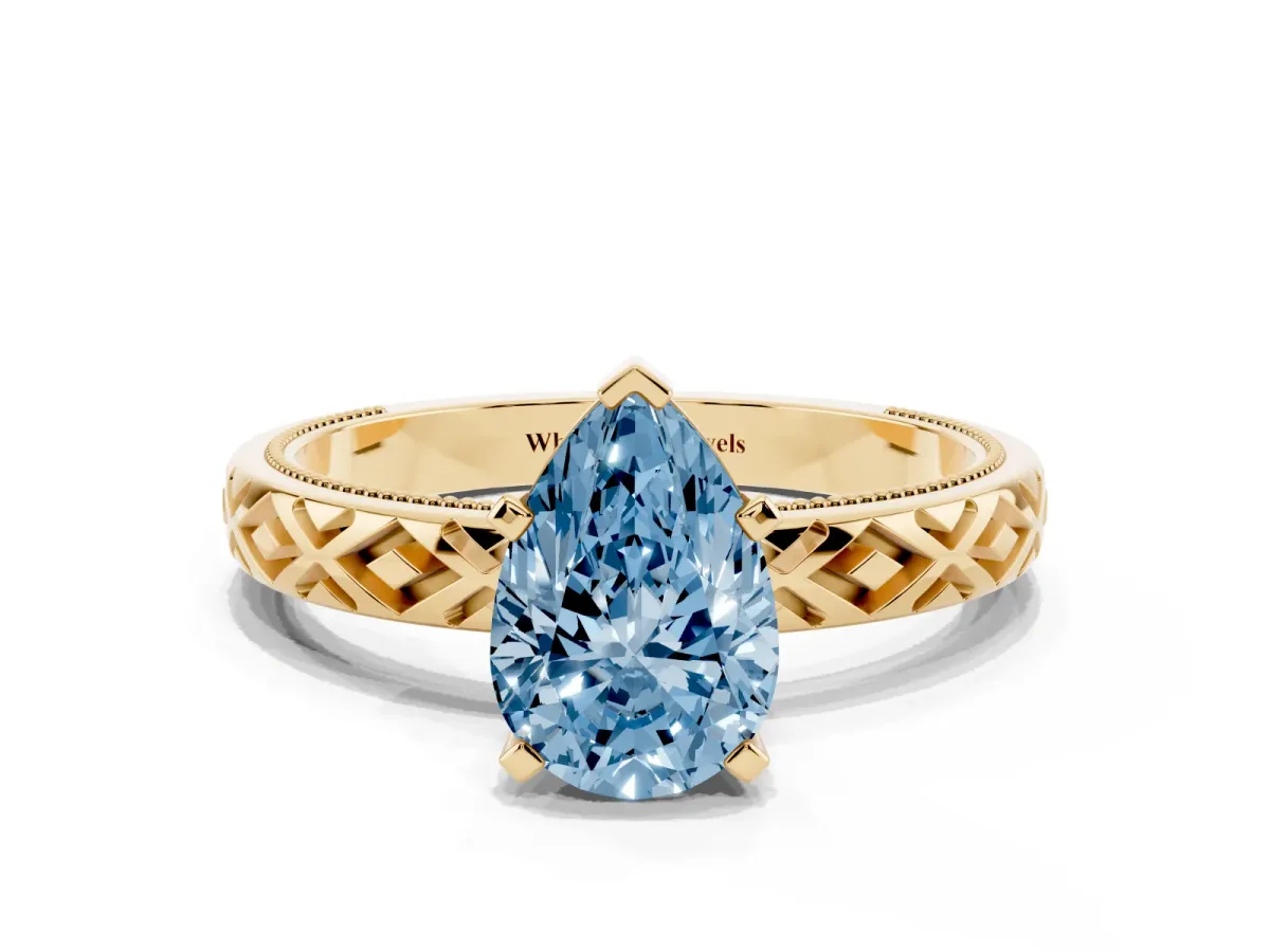 Fancy Blue Pear Cut Solitaire Diamond Ring with Milgrain and Black Enamel X Pattern Band Yellow gold