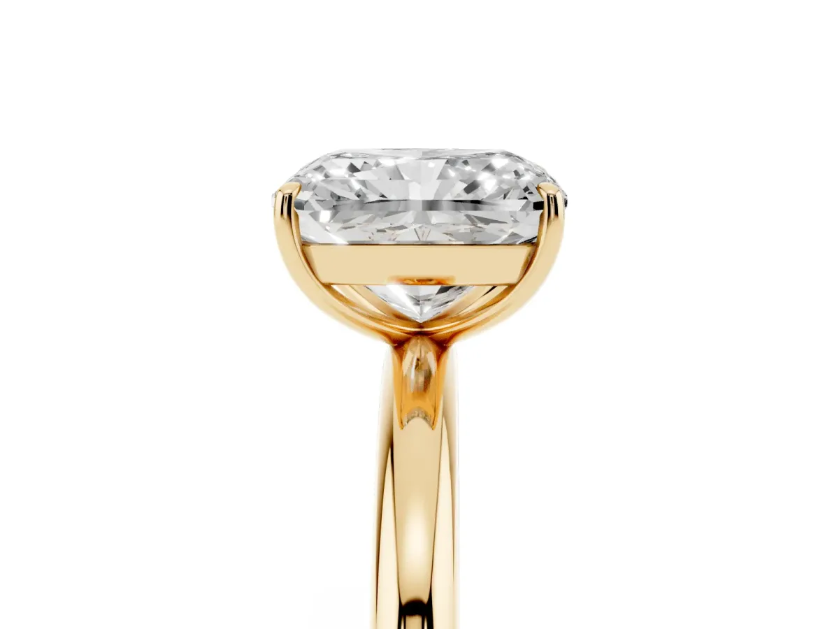 Radiant Cut Solitaire Diamond Ring with Four-Prong Setting on a Plain Band Yellow gold