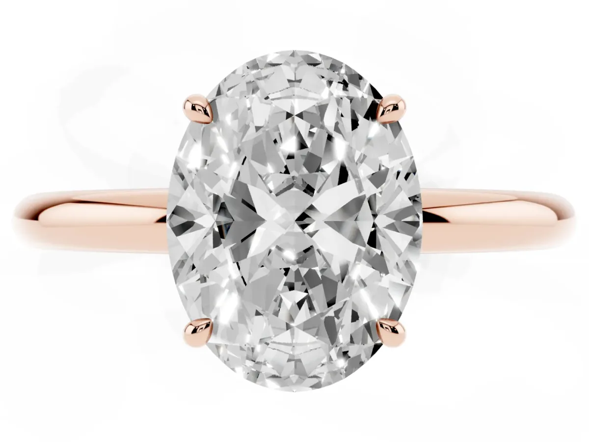 Oval Cut Diamond Solitaire Ring with Thin Band and Four-Prong Setting Rose gold