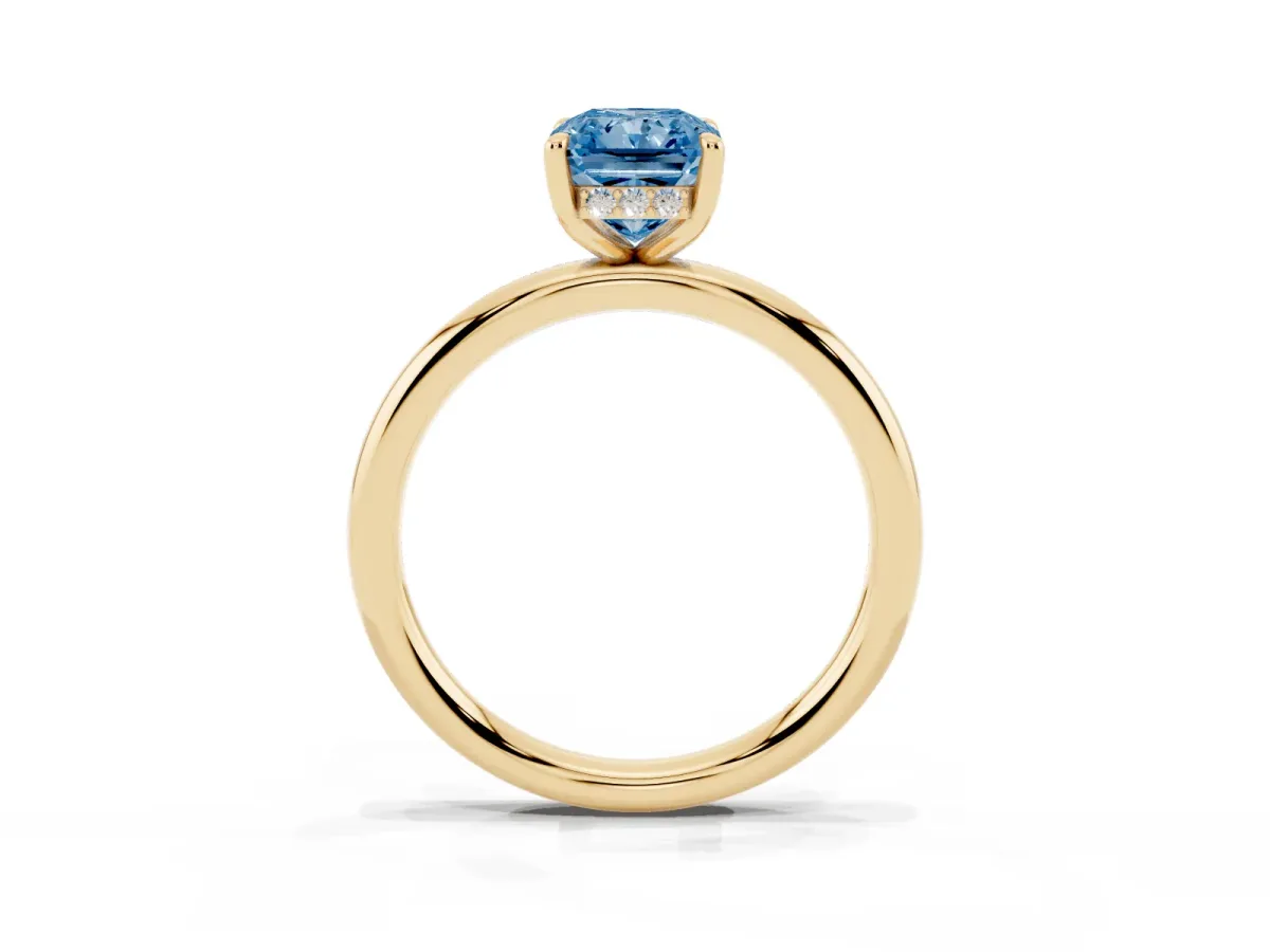 Fancy Blue Radiant Cut Diamond Solitaire Ring with Thin Band and Four-Prong Setting Yellow gold