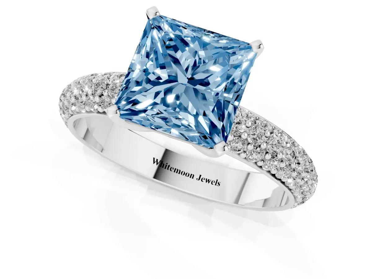 Fancy Blue Princess Cut Diamond Solitaire Ring with Prong Setting and Pavé Band Silver
