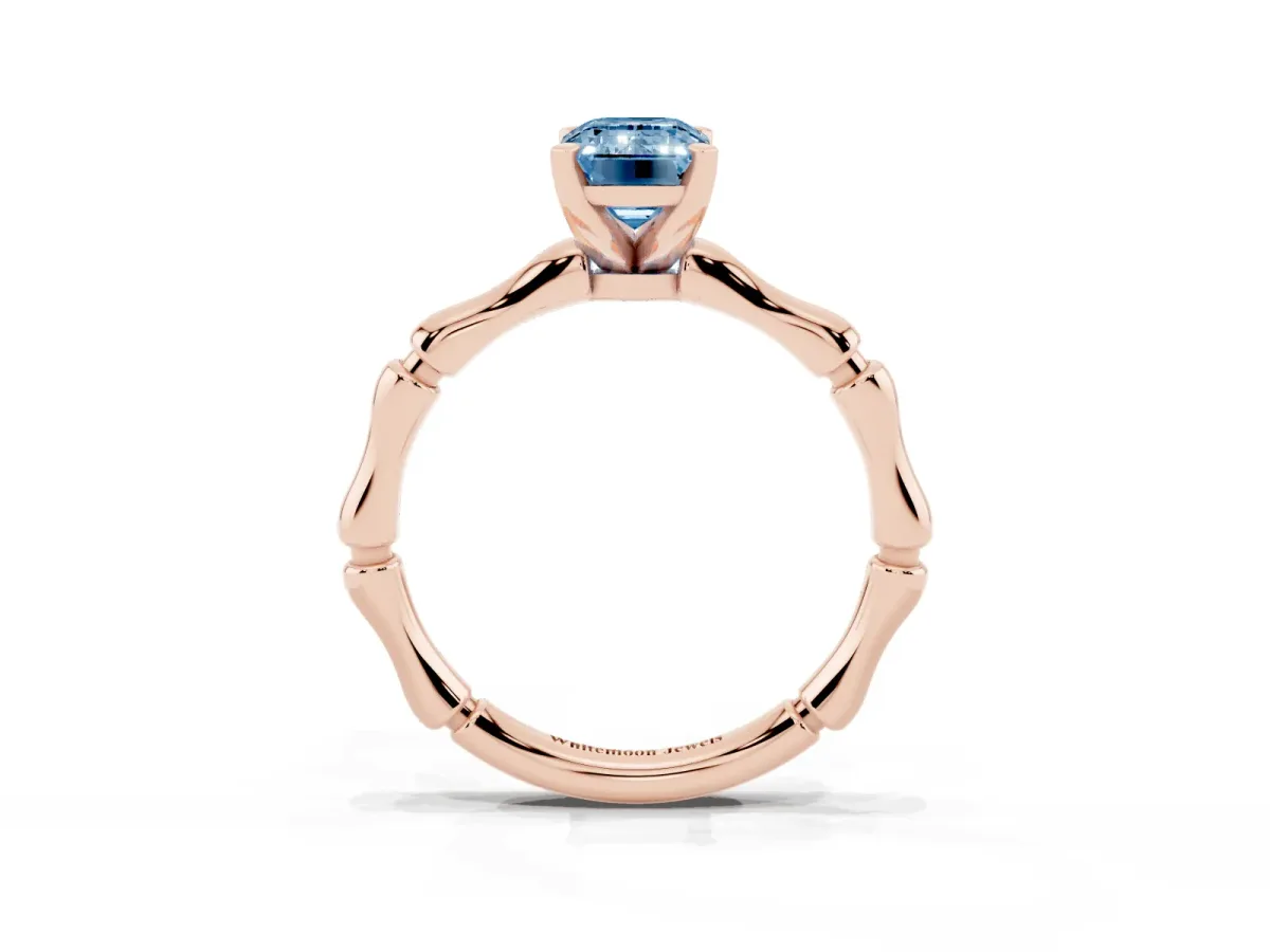 Fancy Blue Emerald Cut Solitaire Diamond Ring with Bamboo Band and Four-Prong Setting Rose gold