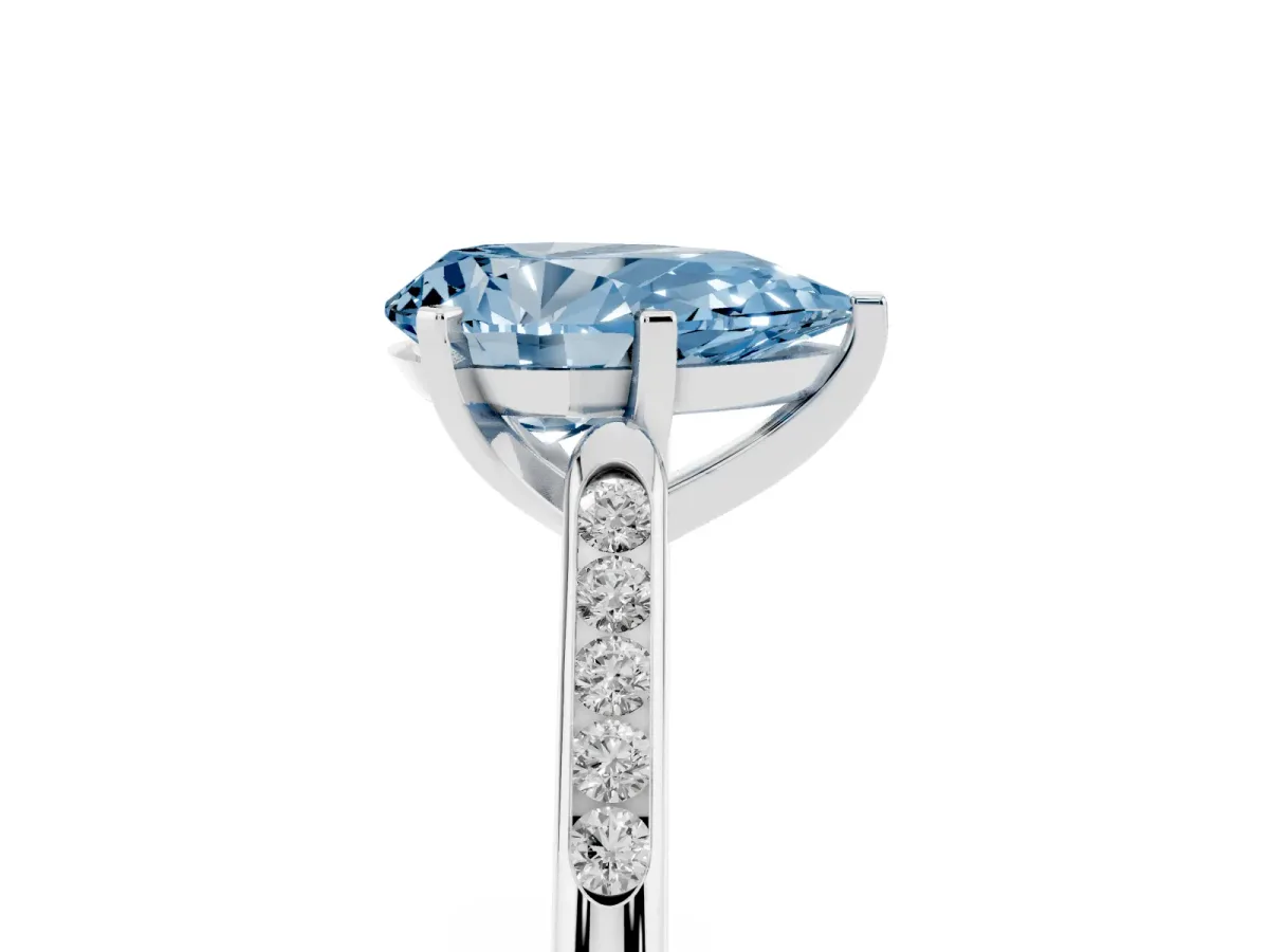 Fancy Blue Pear Cut Diamond Solitaire Ring with Channel Set Round Band and Prong Setting Silver