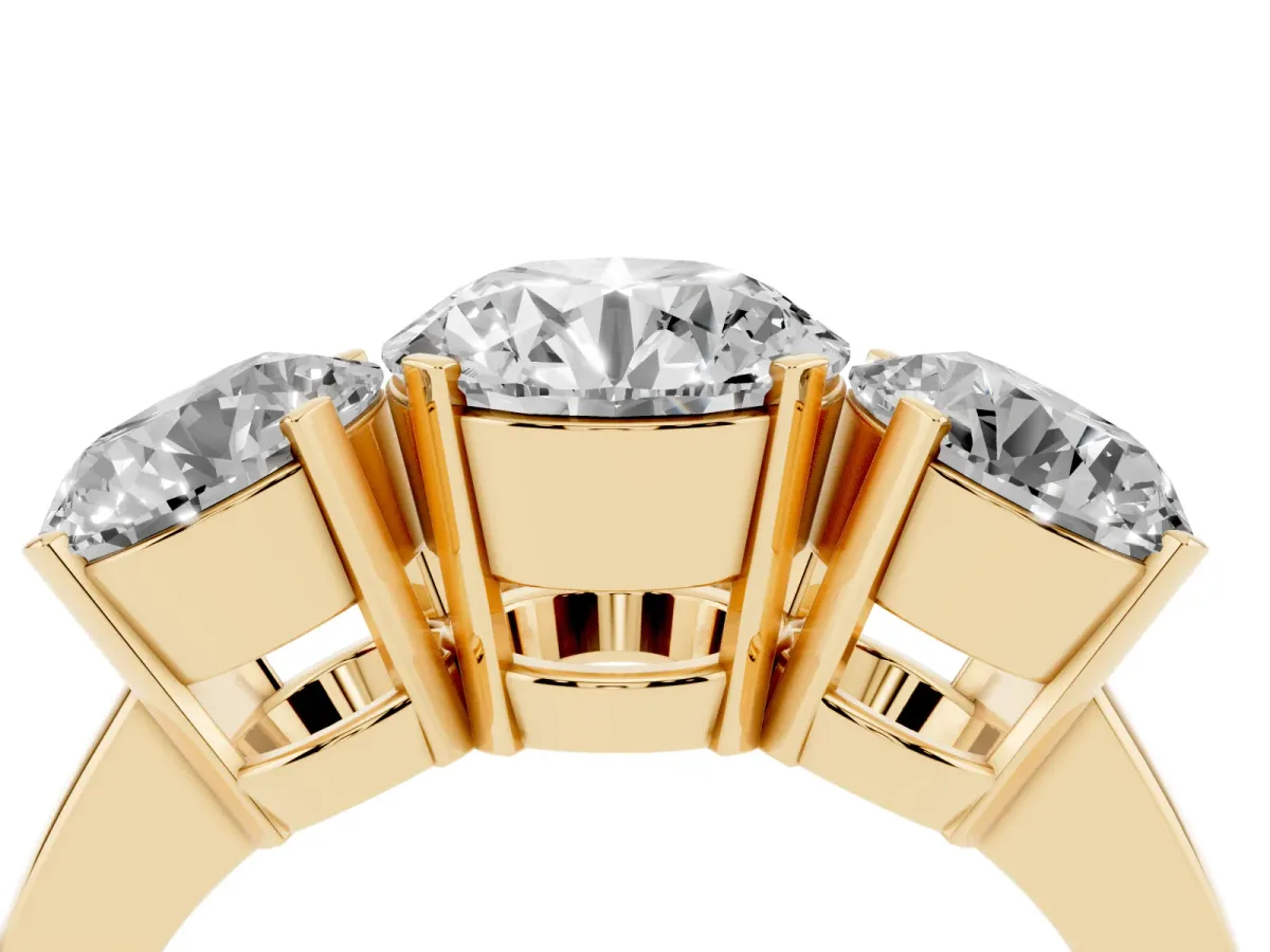 Three-Stone Round Cut Cut Diamond Ring with Channel Set Band and Four-Prong Setting Yellow gold