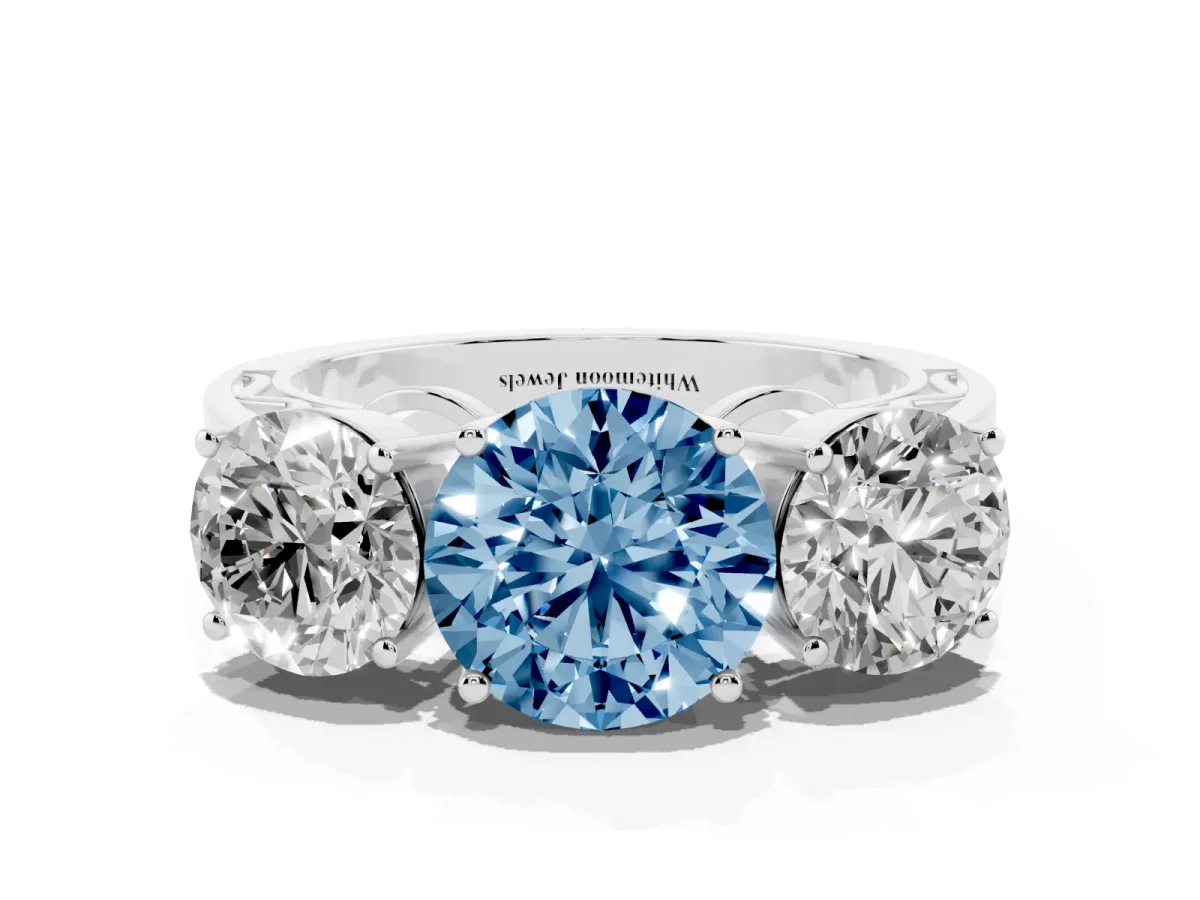 Fancy Blue Round Cut Diamond Three-Stone Ring with Prong Setting and Textured Band Platinum