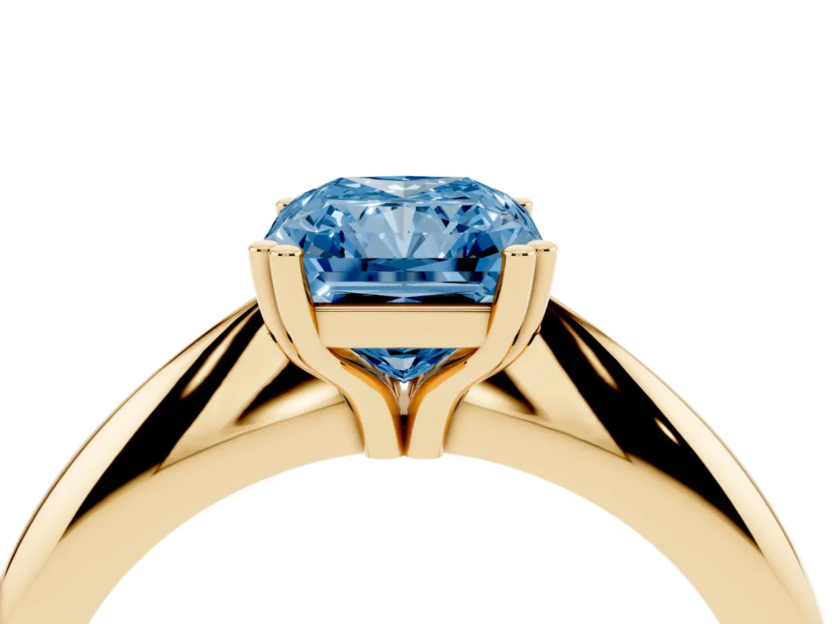 Fancy Blue Radiant Cut Cut Solitaire Engagement Ring with Tapered Band and Four-Prong Setting Yellow gold