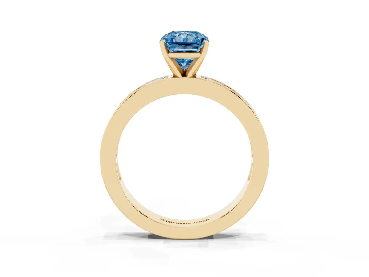 Fancy Blue Radiant Cut Solitaire Diamond Ring with Channel-Set Baguette Band and Four-Prong Setting Yellow gold