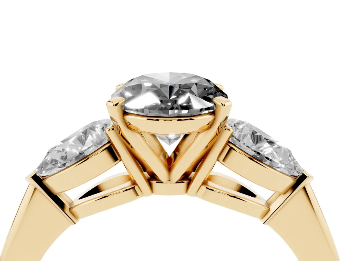 Fancy Black Three-Stone Oval Cut Diamond Ring with Pear Side Stones and Four-Prong Setting Yellow gold