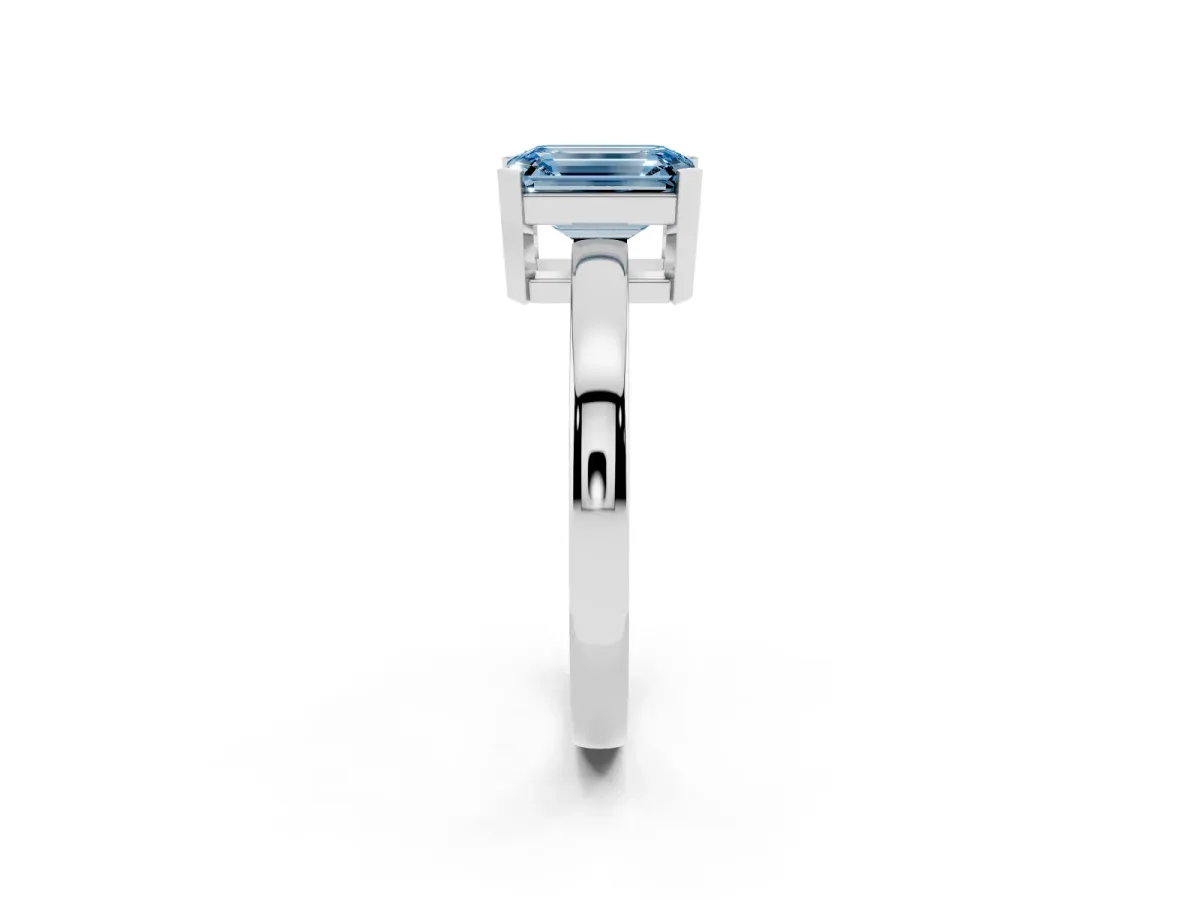 Fancy Blue Emerald Cut Cut Solitaire Ring with Four-Prong Setting and Classic Band Silver