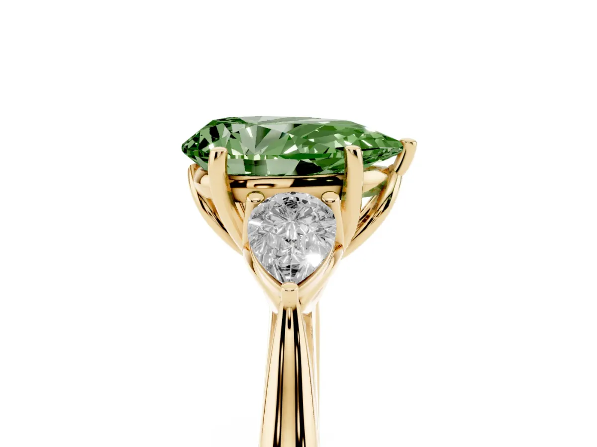 Fancy Green Three-Stone Pear Cut Brilliant Diamond Solitaire Ring with Tapered Band and Four-Prong Setting Yellow gold