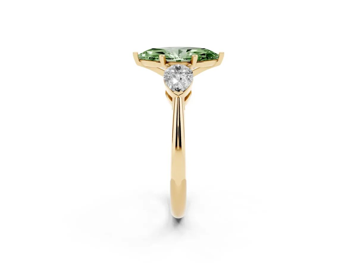 Fancy Green Three-Stone Marquise Cut Diamond Ring with Pear Side Stones and Four-Prong Setting Yellow gold