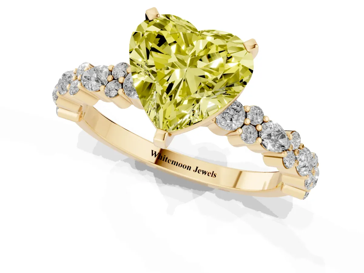 Fancy Yellow Heart Cut Diamond Side Stone Solitaire Ring with Round and Four-Prong Setting Yellow gold