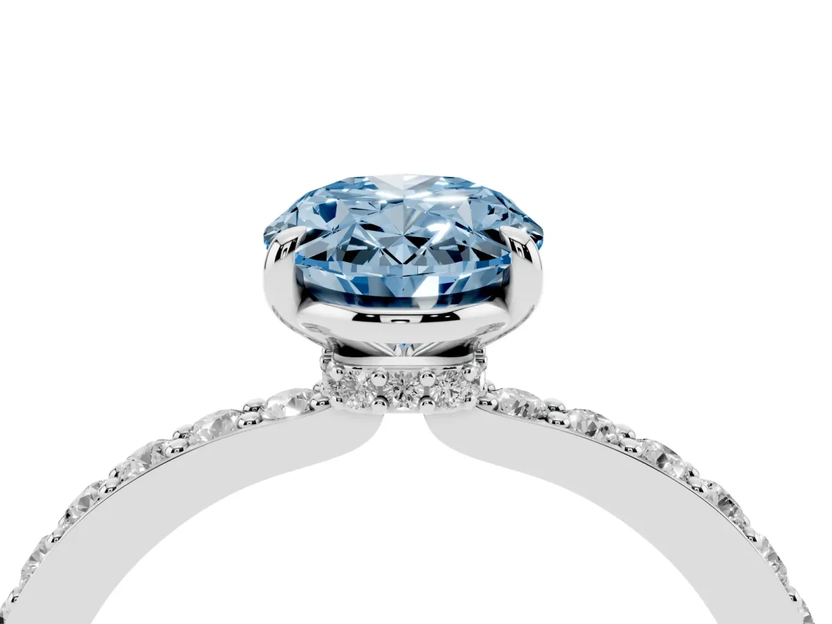 Fancy Blue Oval Cut Diamond Pavé Engagement Ring with Round Accents and Prong Setting Platinum
