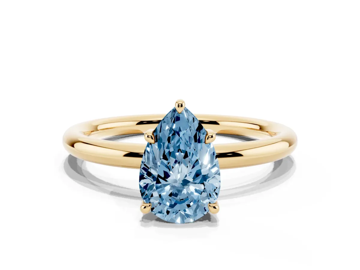 Fancy Blue Pear Cut Diamond Solitaire Ring with Thin Band and Four-Prong Setting Yellow gold