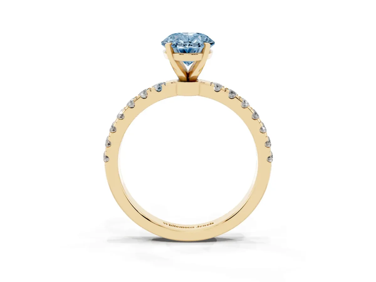 Fancy Blue Oval Cut Diamond Solitaire Ring with Pavé Accents and Four-Prong Setting Yellow gold