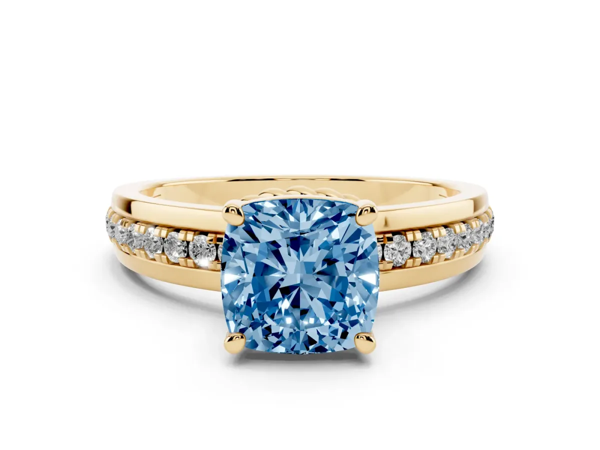 Fancy Blue Cushion Cut Solitaire Diamond Ring with Channel Set Band and Six-Prong Setting Yellow gold