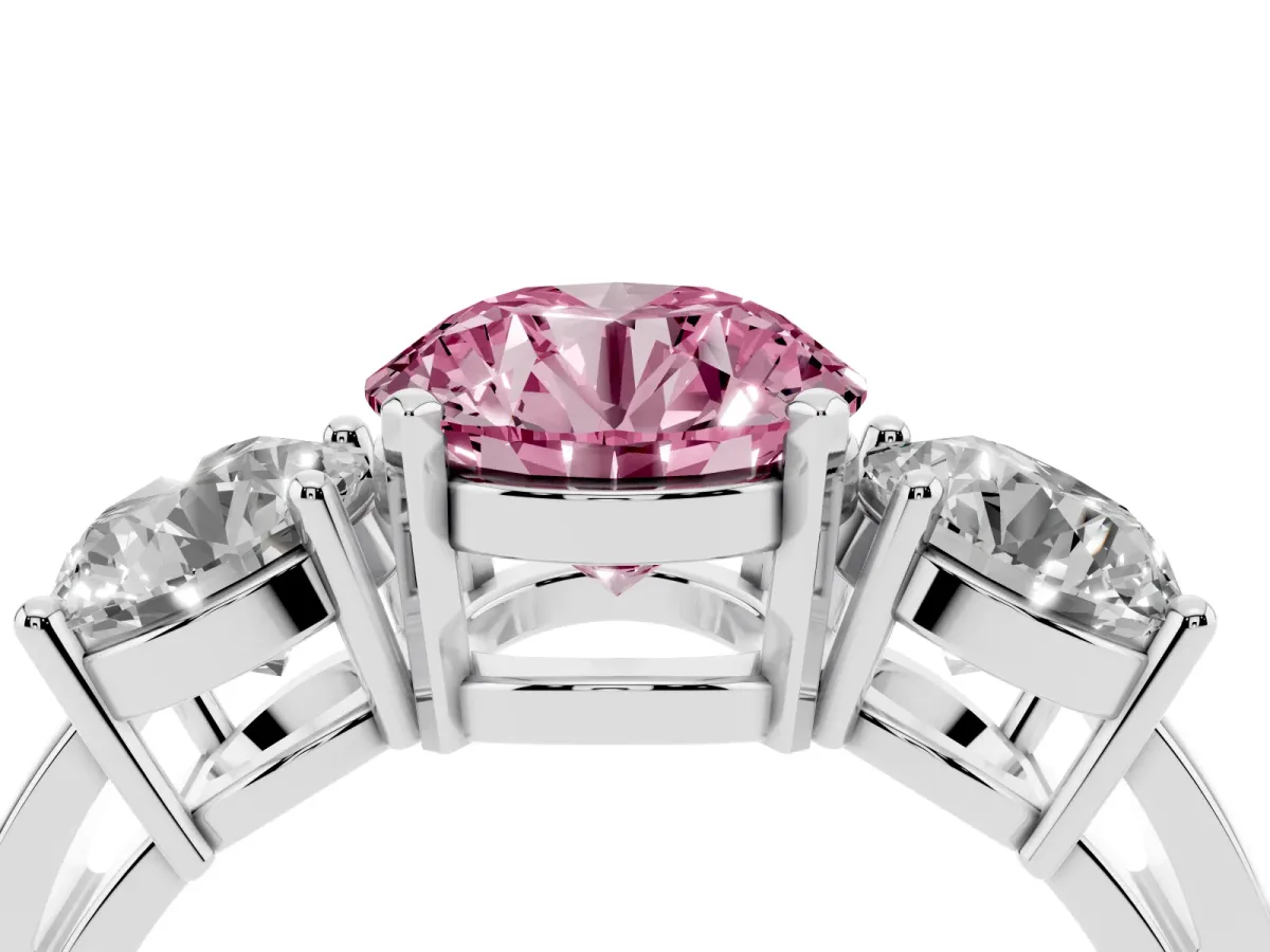 Fancy Pink Three-Stone Round Cut Diamond Ring with Round Side Stones, Classic Band, and Four-Prong Setting Platinum