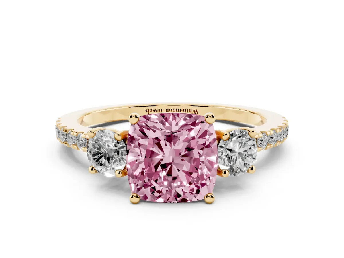 Fancy Pink Three-Stone Cushion Cut Cut Diamond Pavé Band with Prong Setting Yellow gold