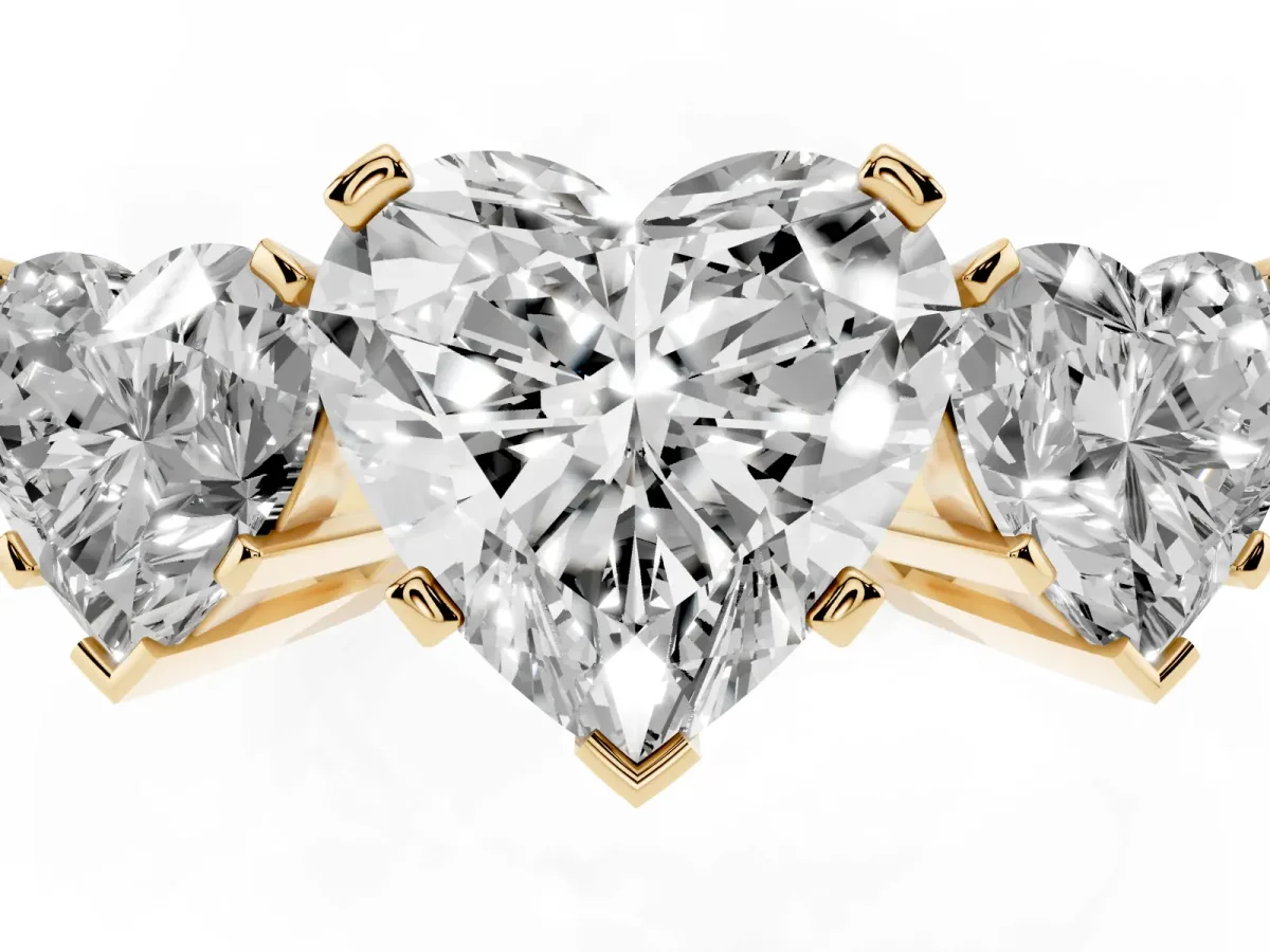 Three-Stone Heart Cut Cut Diamond Ring with Channel Set Band and Four-Prong Setting Yellow gold