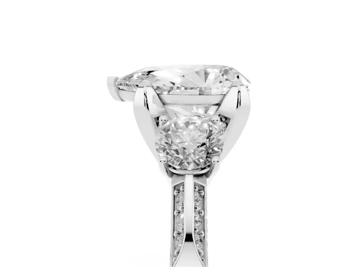 Pear Cut Brilliant Three-Stone Diamond Ring with Pavé Band and Four-Prong Setting Silver
