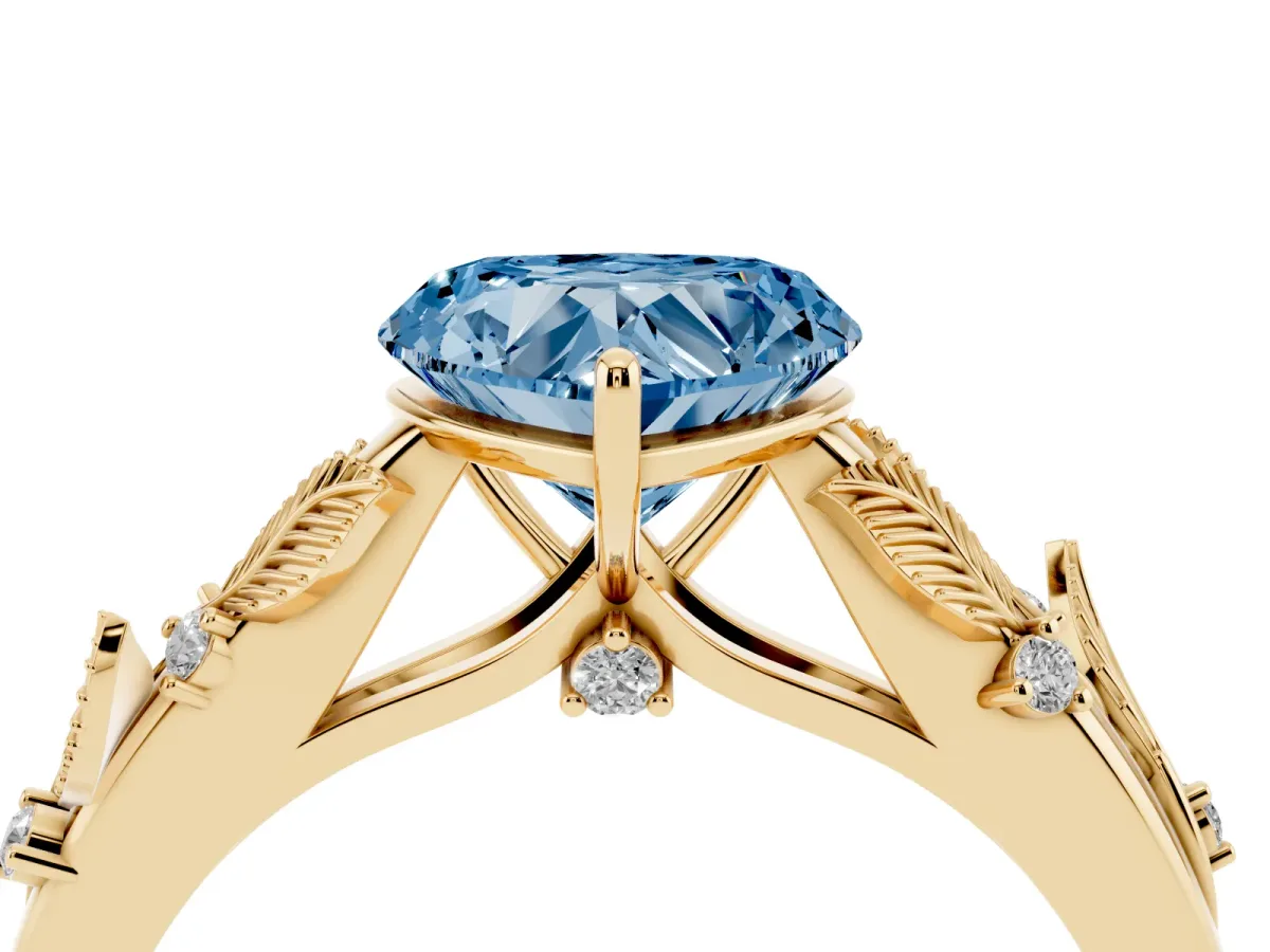 Fancy Blue Heart Cut Diamond Solitaire Ring with Leaf Motif Band and Four-Prong Setting Yellow gold