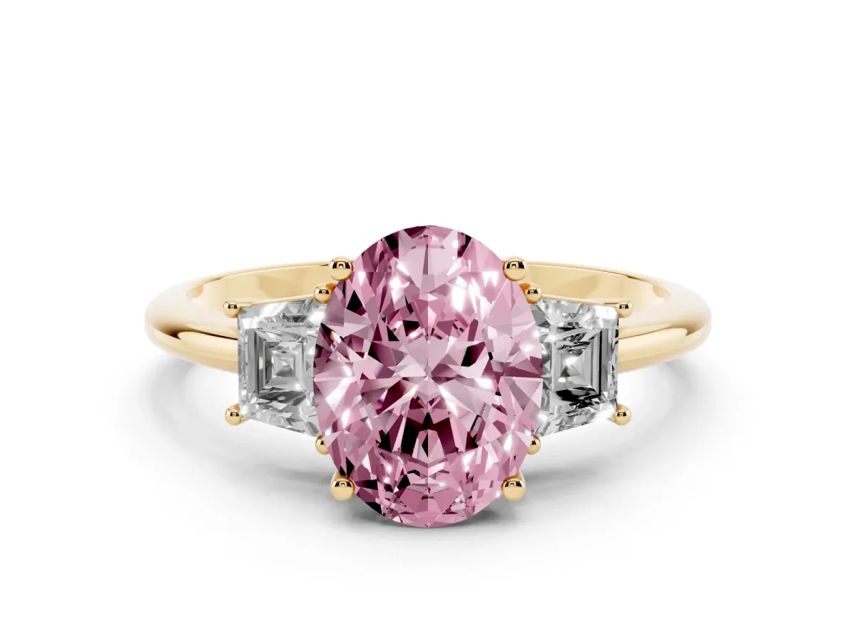 Fancy Pink Oval Cut Diamond Three-Stone Ring with Trapezoid Side Stones and Prong Setting Yellow gold
