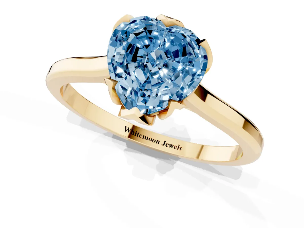 Fancy Blue Heart Cut Diamond Solitaire Ring with Flower Prong Setting and Classic Band Yellow gold