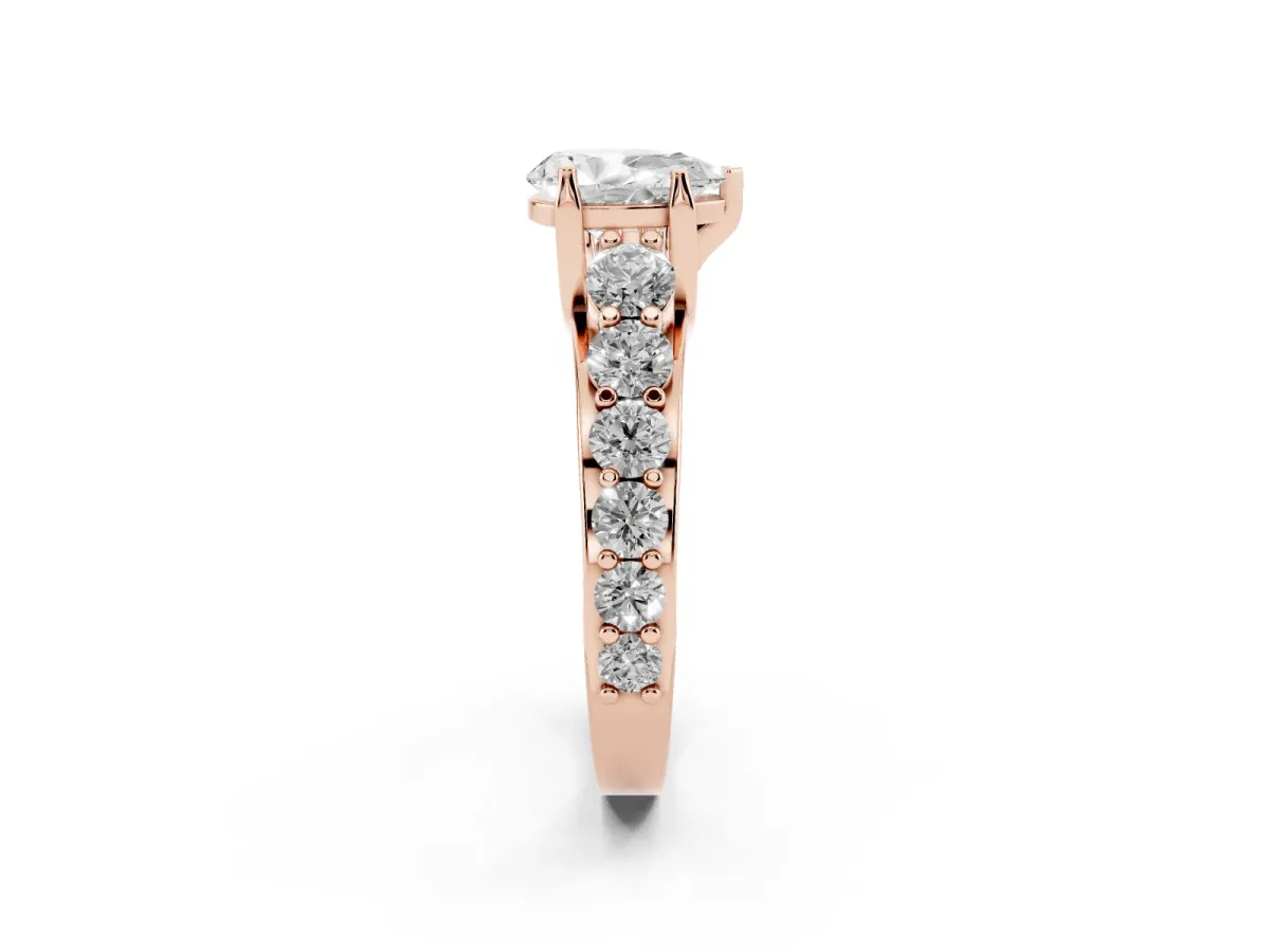 Pear Cut Diamond Engagement Ring with Pavé Band and Four-Prong Setting Rose gold