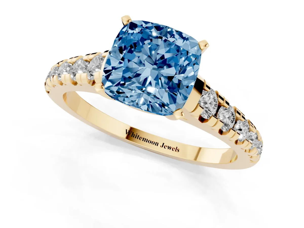 Fancy Blue Cushion Cut Diamond Cathedral Solitaire Ring with Round Pavé Band Yellow gold