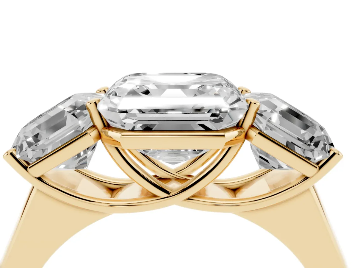 Asscher Cut Three-Stone Diamond Ring with Prong Setting on a Classic Band Yellow gold