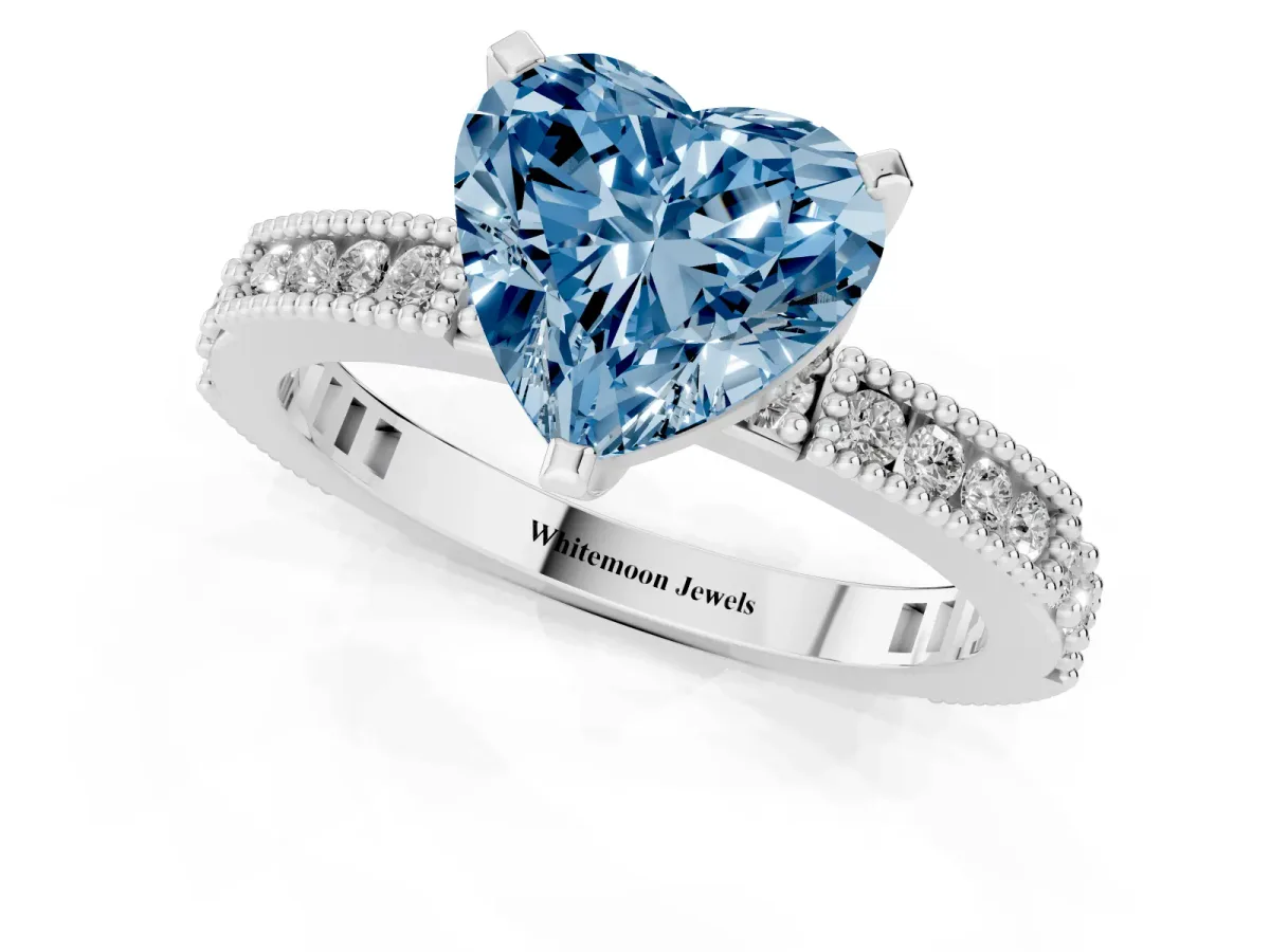 Fancy Blue Heart Cut Solitaire with Pavé Band and Four-Prong Setting Silver