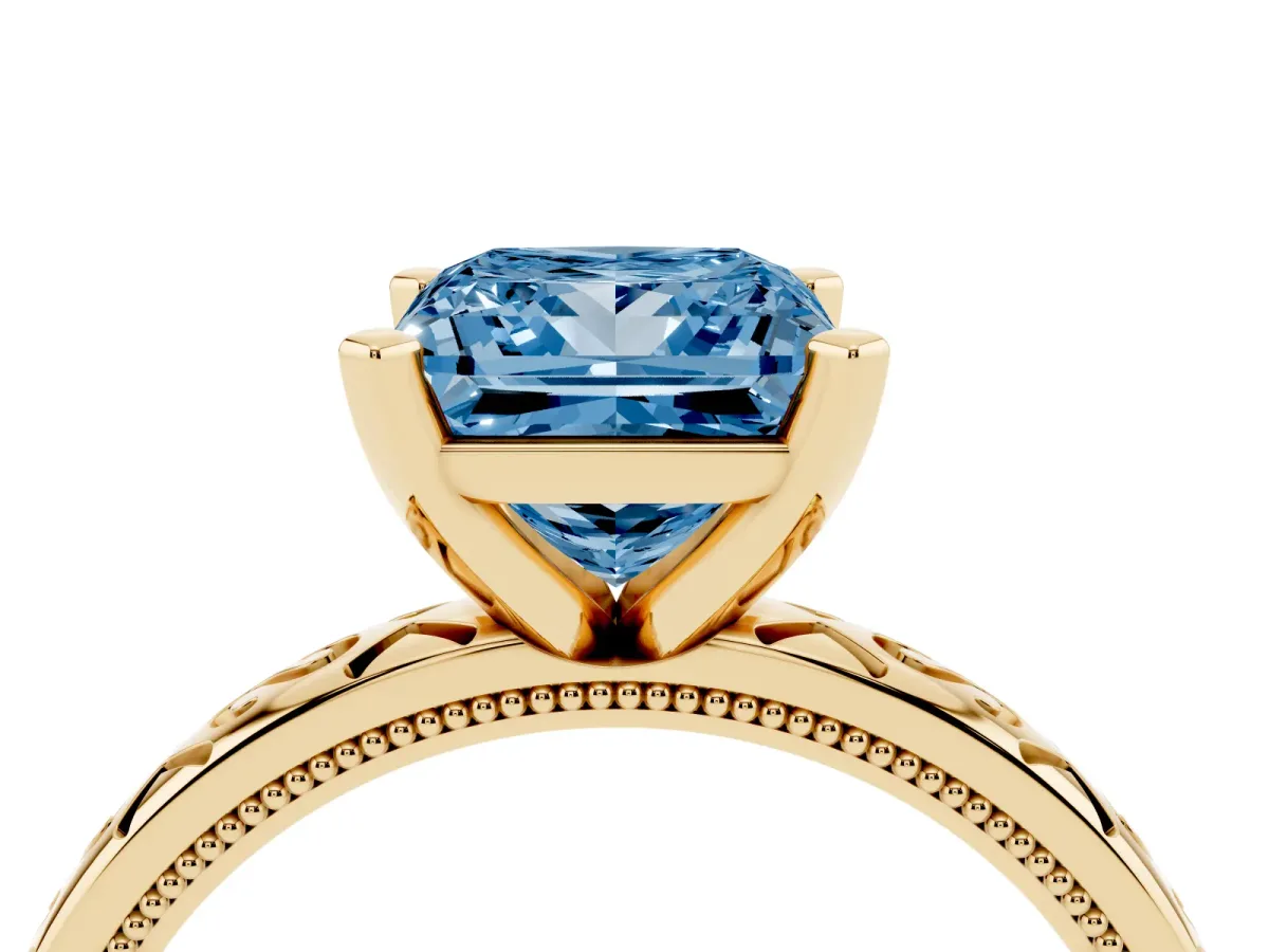 Fancy Blue Princess Cut Solitaire Engagement Ring with Scrollwork Band and Four-Prong Setting Yellow gold