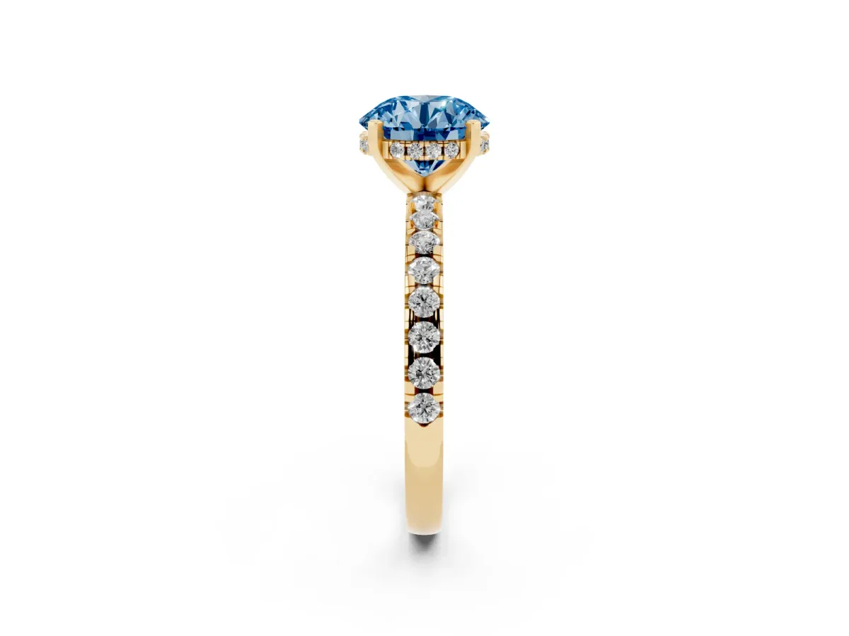 Fancy Blue Round Cut Diamond Solitaire Ring with Round Pavé Band and Four-Prong Setting Yellow gold