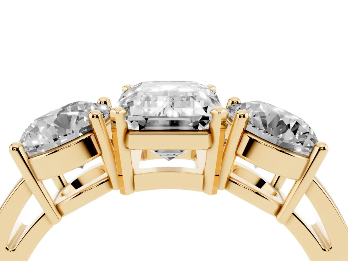 Three-Stone Emerald Cut Diamond Ring with Round Side Stones, Classic Band, and Four-Prong Setting Yellow gold