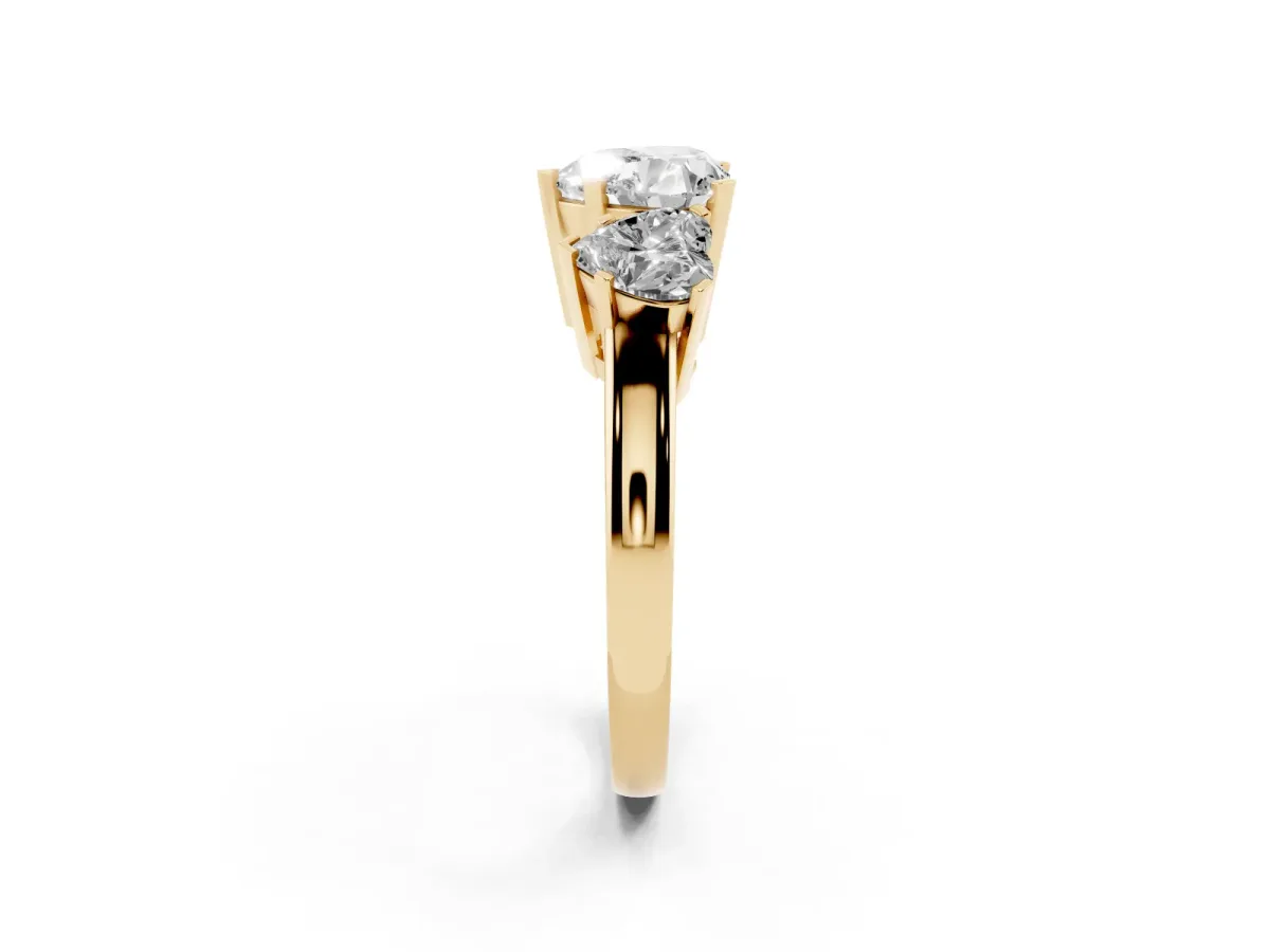 Three-Stone Heart Cut Cut Diamond Ring with Channel Set Band and Four-Prong Setting Yellow gold