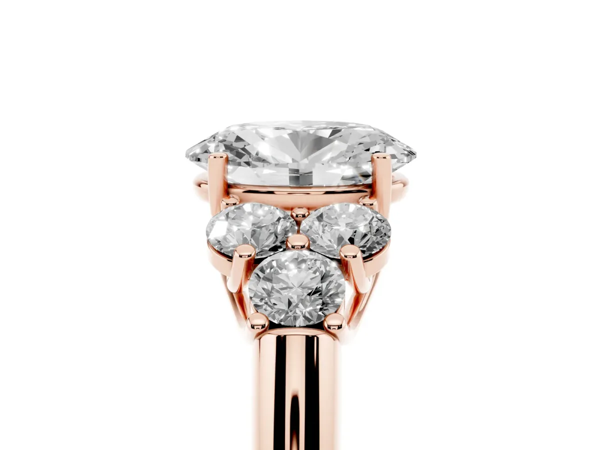 Oval Cut Cut Diamond Cluster Ring with Round Accent Stones and Prong Setting on a Classic Band Rose gold