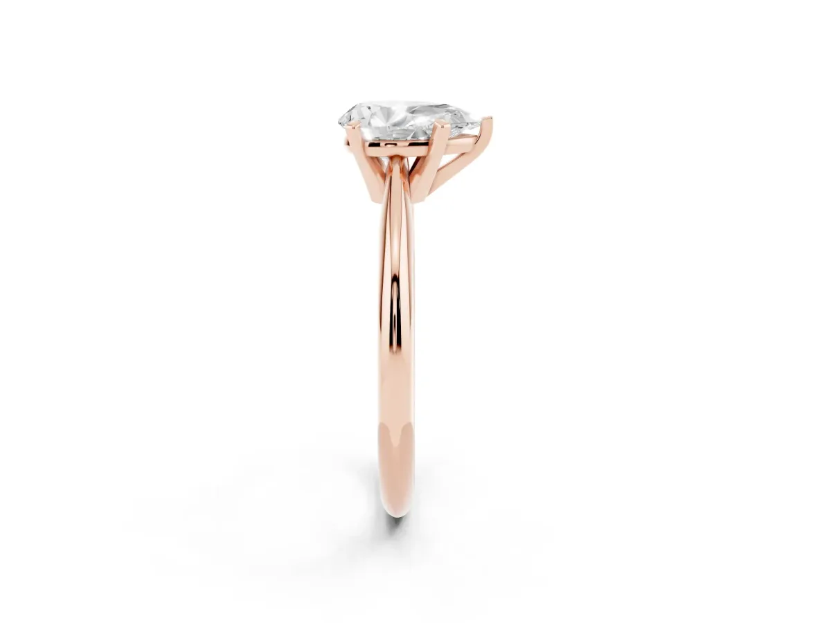 Pear Cut Cut Solitaire Ring with Four-Prong Setting on a Classic Band Rose gold