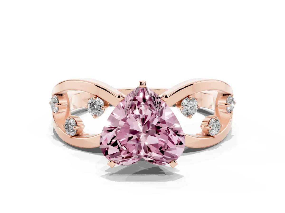 Fancy Pink Heart Cut Cut Solitaire Diamond with Side Stones on Criss-Cross Band and Four-Prong Setting Rose gold