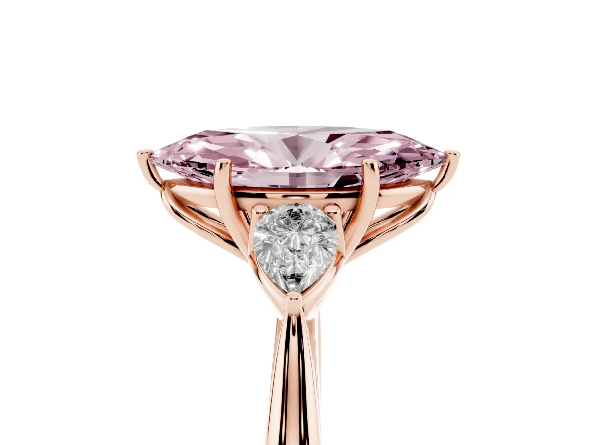 Fancy Pink Three-Stone Marquise Cut Diamond Ring with Pear Side Stones in Four-Prong Setting Rose gold