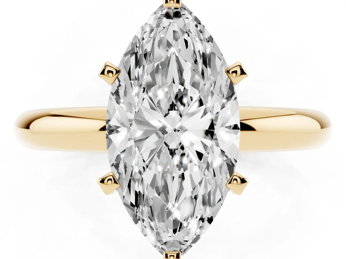Marquise Cut Diamond Solitaire Engagement Ring with Round Band and Four-Prong Setting Yellow gold
