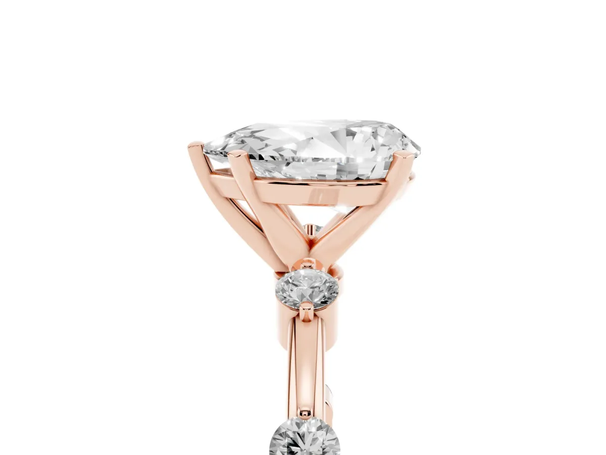 Pear Cut Solitaire Diamond Ring with Bezel Set Side Stones and Prong Setting Rose gold