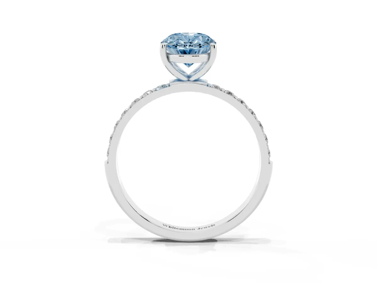 Fancy Blue Oval Cut Diamond Solitaire Ring with Round Pavé Shoulders and Prong Setting Silver