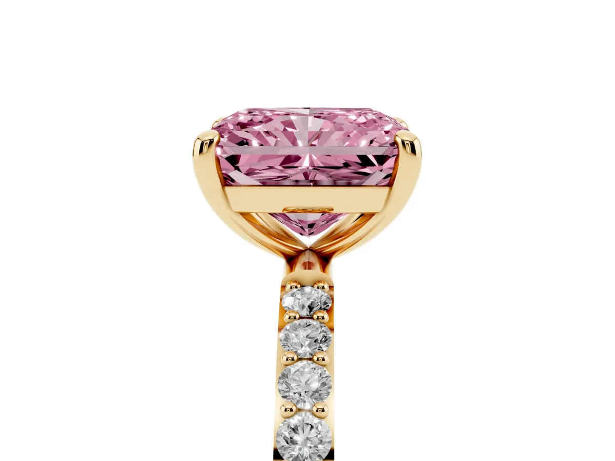 Fancy Pink Radiant Cut Diamond Solitaire Ring with Round Pavé Band and Prong Setting Yellow gold
